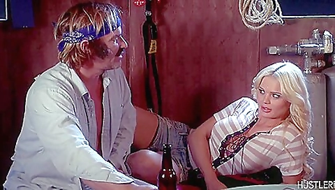 Sexy blonde is wearing a sexy black dress and white blouse