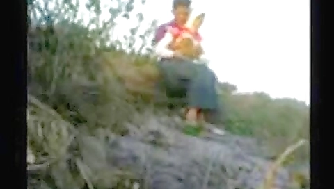 A little girl with small boobs and a black dress dancing