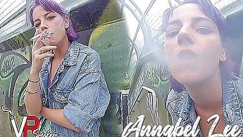 Anabel lee stretches on the bridge with a cigarette