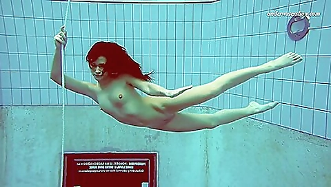 Amazing brunette in a sexy black dress and stockings