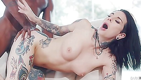 Hot brunette in sexy lingerie in bed fucks her pussy