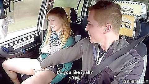 Busty blonde gets it on with a black man in the car