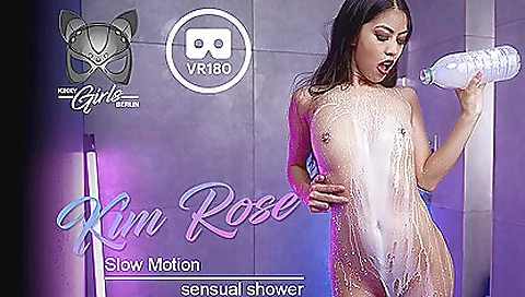 Brunette in a sexy outfit shows off her pussy in a shower